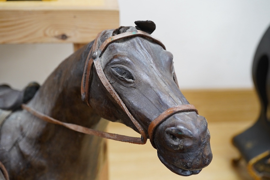 A pair of leather covered models of horses possibly Omersea for Liberty, 49cm. Condition - fair